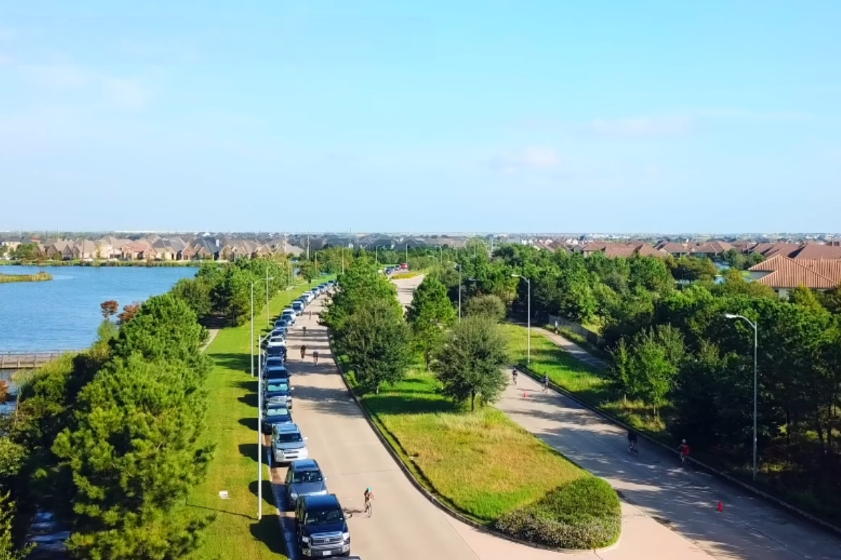 A tree-lined street through one of Fulshear's newer master-planned communities.